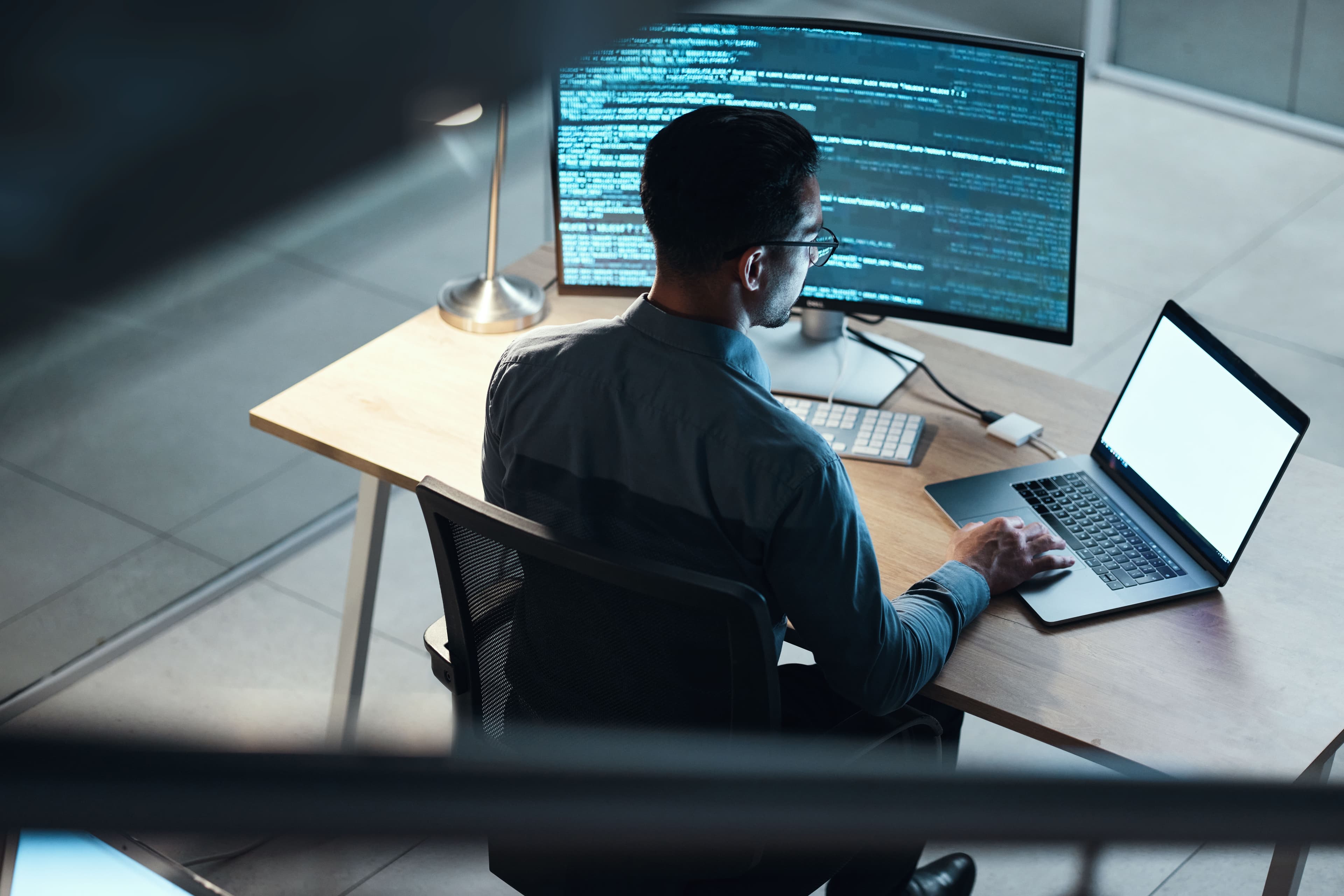 Security practitioner working at his work station